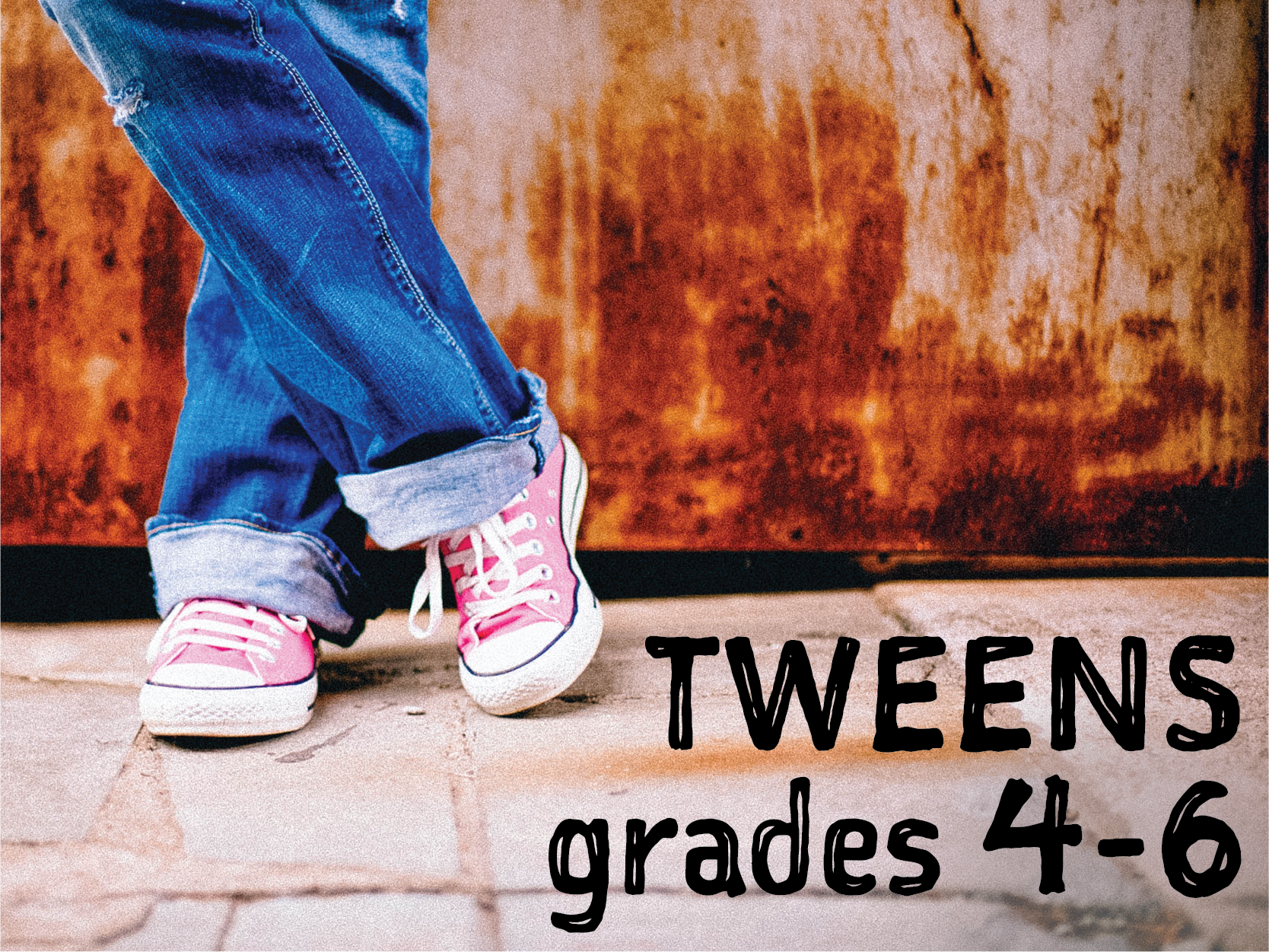 Tweens grades 4-6. Photo of legs in blue jeans with pink Converse sneakers