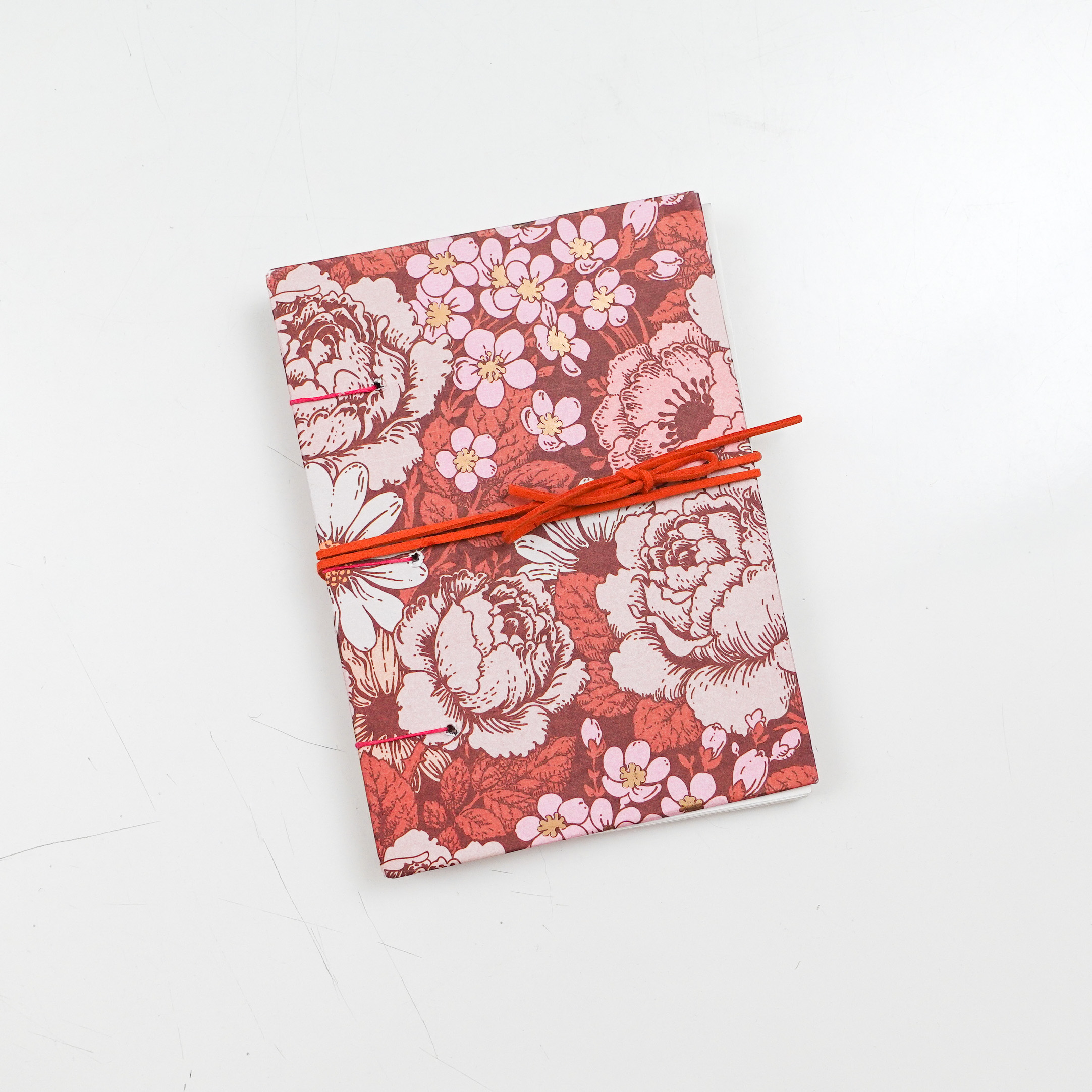 Homemade Sketchbook with a floral pattern and a ribbon closure
